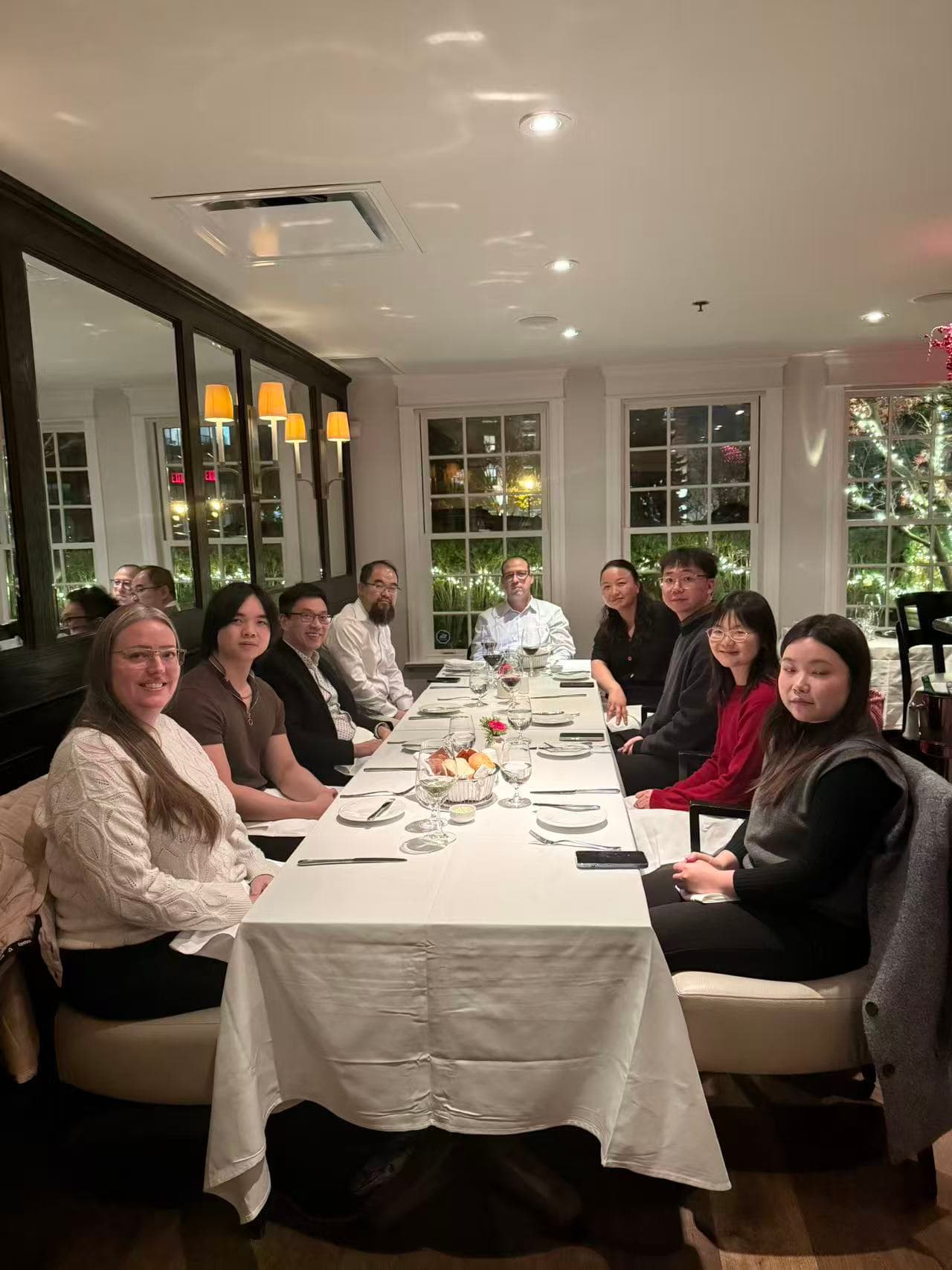 A group of professionals gathered around a dinner table